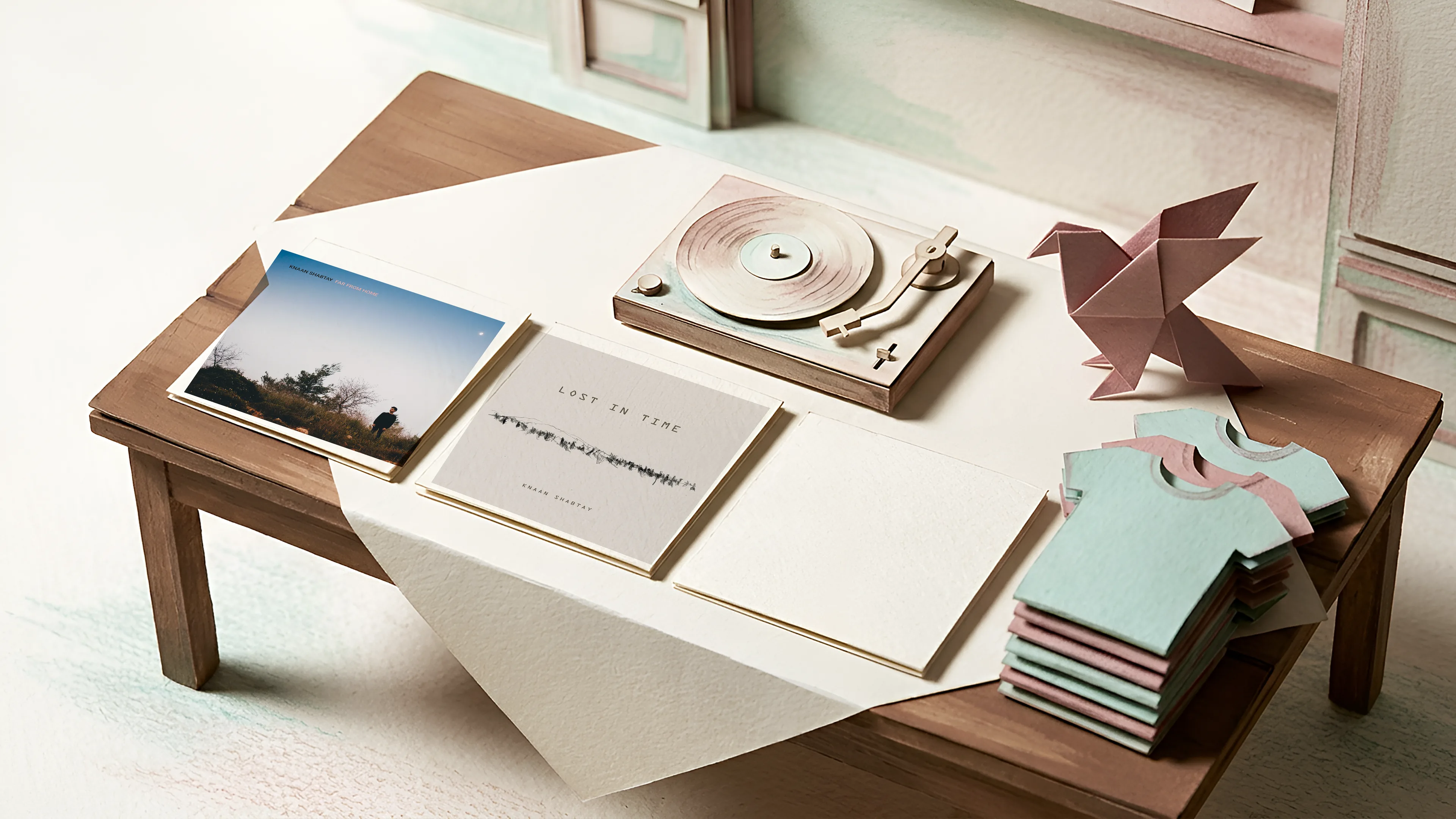 Paper merch table with a turntable and records